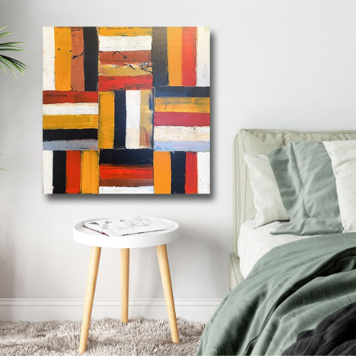 A Country Mile by Ludwina Orchard – abstract geometric acrylic painting with red, orange and blue blocks displayed above a stool in a sage green bedroom