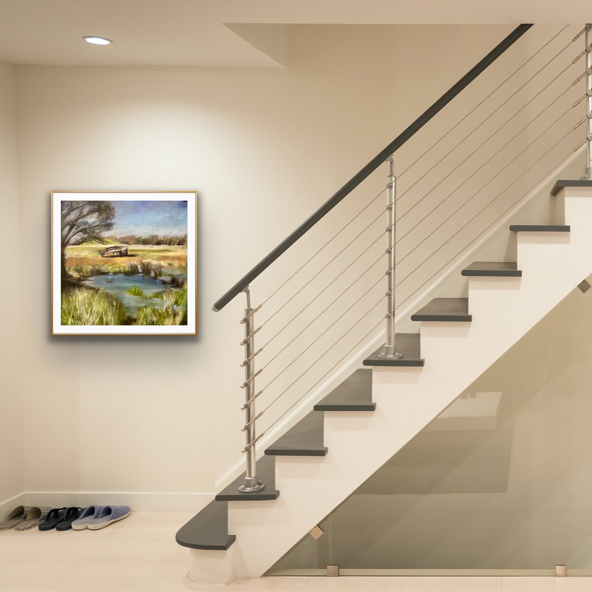 Abandoned by Ludwina Orchard – soft pastel painting displayed in a modern hallway beside a staircase