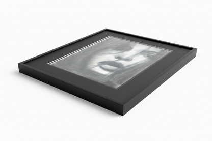 Do You See Me by Ludwina Orchard – angled product shot of a charcoal portrait in a deep black frame, showing depth and craftsmanship on a white background