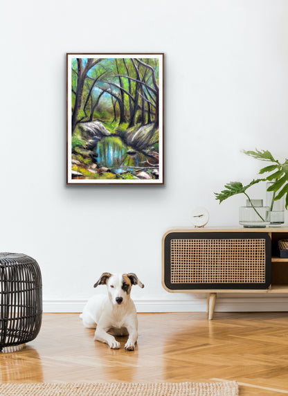 Everglades by Ludwina Orchard – framed soft pastel forest painting hung on a wall in a modern living room with a white dog resting on a timber floor