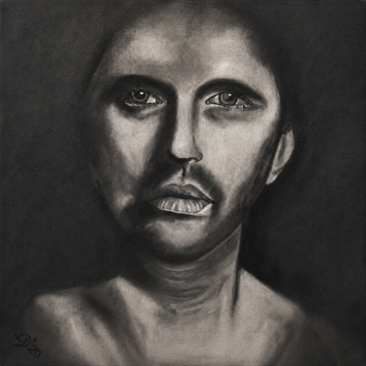 The Man Within by Ludwina Orchard – charcoal portrait painting of a man's face with intense eyes on dark background, charcoal on paper