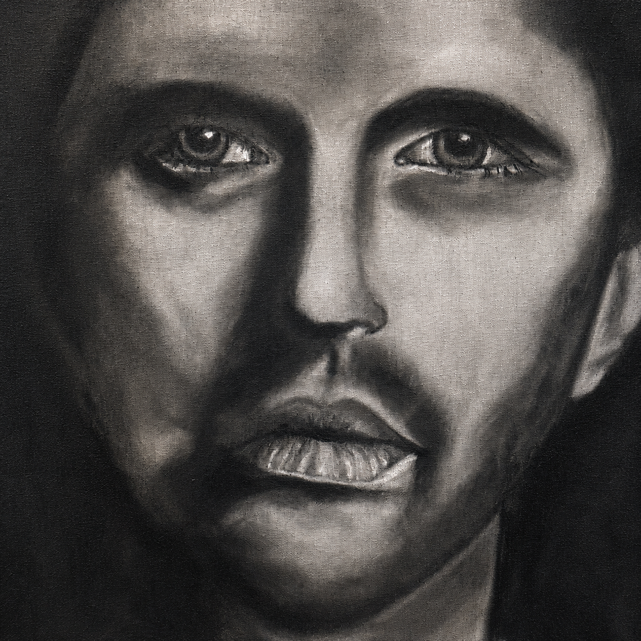 The Man Within by Ludwina Orchard – close-up detail of the charcoal portrait showing intense eyes and facial features, charcoal on paper