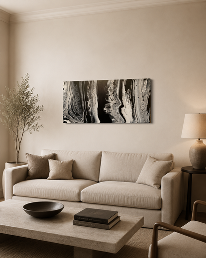 Wisdom by Ludwina Orchard – ring-poured acrylic painting displayed above a beige sofa in a warm modern living room